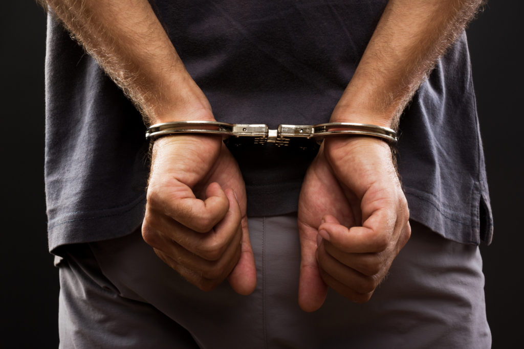 handcuffed man