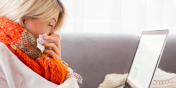 a woman has a runny nose