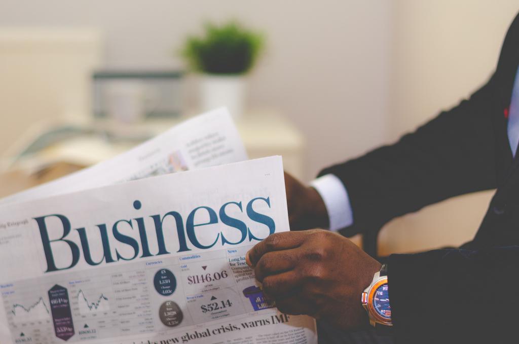Newspaper in the hands of a businessman