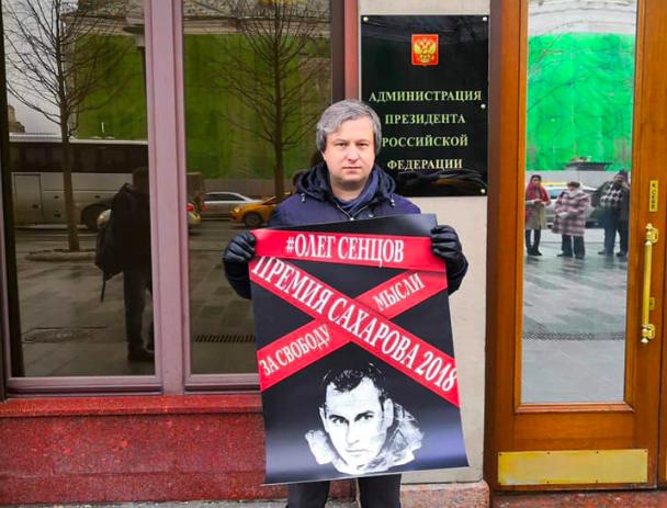 Anton Dolin with a poster